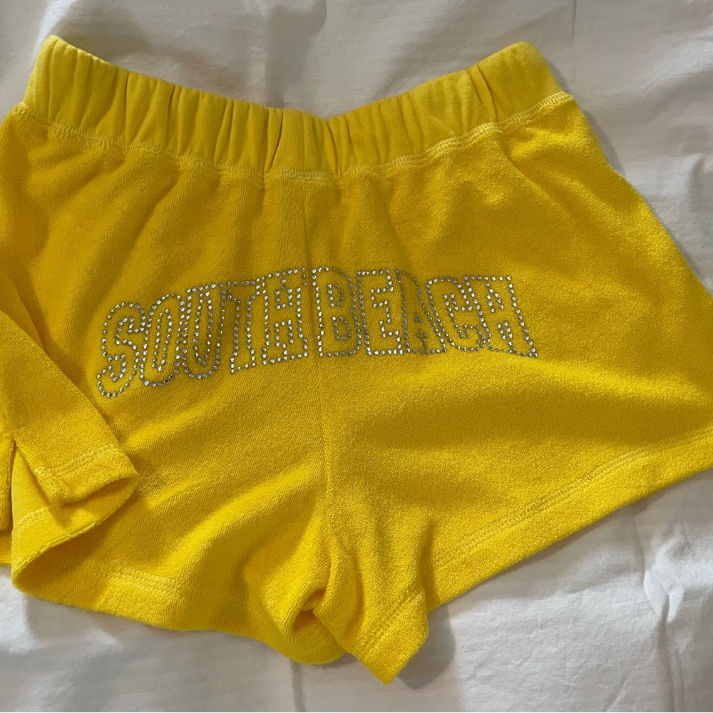 Women’s short Terry shorts with “South Beach” in silver stones.
